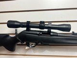 Used Remington Model 597 22 mag 19" barrel black synthetic stock and forearm golden antler scope good condition - 8 of 20