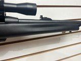 Used Remington Model 597 22 mag 19" barrel black synthetic stock and forearm golden antler scope good condition - 5 of 20