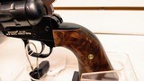 Used Ruger Single Six 5 1/2" barrel.22 and .22 mag cylinders hard plastic case manuals custom grips good condition - 4 of 20