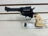Used Ruger Single Six 22LR4 1/2" bbl cream grips on blue frame very good condition