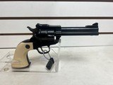 Used Ruger Single Six 22LR4 1/2" bbl cream grips on blue frame very good condition - 2 of 15