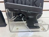Glock 27 40sw 3 1/4" bbl unfired with box2 mags grip adjusters manuals unfired condition - 9 of 10