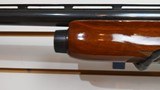 qUsed Remington 1100 12 gauge 3" magnum 28" bbl good condition - 10 of 25