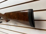 Used Remington 1100 12 gauge 28" bbl fixed choke skeet good condition - 2 of 19
