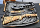 RUGER 10-22 TAKE DOWN WITH CAMO, FLASH HIDER, LASER SIGHT, 10 ROUND MAGAZINE AND 25 ROUND RUGER MAGZINE RUGER CARRYING BAG - 1 of 3