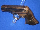 AN EARLY AND SCARCE REMINGTON ELLIOTT FOUR BARREL REPEATING PEPPERBOX DERINGER WITH ORIGINAL CARDBOARD BOX IN FINE UNTOUCHED CONDITION! - 2 of 17