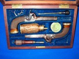 An Early Civil War Circa 1850's To 1860's Pair Of Percussion Single Shot Pistols In Their Original Case With Accessories - 1 of 4