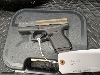 GLOCK 43 WITH BURNT BRONZE AMERICAN FLAG CERACOATED SLIDE, IN 9MM, IN EXCELLENT CONDITION