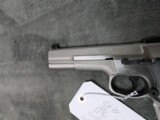 SMITH & WESSON PERFOMANCE CENTER PPC MODEL 9MM
WITH 5