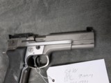 SMITH & WESSON PERFOMANCE CENTER PPC MODEL 9MM
WITH 5