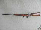 1988 RUGER M77 7MM REMINGTON MAGNUM CALIBER BOLT ACTION REPEATER WITH ORIGINAL RED BUTT PAD - 1 of 21