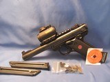 “READY TO GO RACE GUN” RUGER MARK IV 22LR SEMI AUTO PISTOL WITH INSTALLED VOLQUARTSEN ACCURSING KIT - 1 of 18