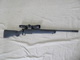MOSSBERG PATRIOT 450 BUSHMASTER BOLT ACTION RIFLE WITH COMP & 3-9X40 SCOPE