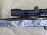 SAVAGE MODEL 10 TACTICAL BOLT ACTION DIGITAL CAMO 223 RIFLE WITH BUSHNELL 3-9X40 DUPLEX AND LOOKS UNFIRED - 10 of 17