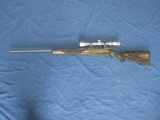 VERY NICE LEFT HAND RUGER M77 STAINLESS HAWKEYE 270 LAMINATED BOLT ACTION RIFLE WITH SCOPE - 1 of 16