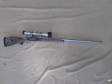 REMINGTON 700 STAINLESS LAMINATED 7MM REM ULTRA MAGNUM BOLT ACTION RIFLE & BAUSCH & LOMB ELITE 4200 SCOPE RUM