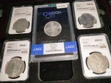 A collection of NGC
graded
Morgan Silver Dollars
& 1882-CC MS 64 GSA
Hoard with display tray - 1 of 5