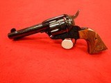 RUGER PRE-OWNED UNFIRED ENGRAVED BLUE JOHN WAYNE COMMEMORATIVE VAQUERO .45 COLT - 1 of 11