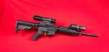 Bushmaster XM-15 E2S 5.56/223 w/scope and Surefire flashlight - 1 of 14