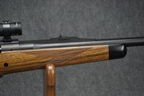 AS NEW, ONLY FIRED TO SIGHT IN SCOPE - DAKOTA ARMS MODEL 76 RIFLE CHAMBERED IN 416 RIGBY WITH TRIJICON 1-4X24 SCOPE! RIFLE IS AS NEW. - 4 of 12