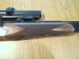 Heym 55 DBSS Sidelock Double Rifle with Animal Engraving in 9,3X74R-Zeiss Scope and Swing Mounts.
- 8 of 15