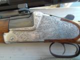 Heym 55 DBSS Sidelock Double Rifle with Animal Engraving in 9,3X74R-Zeiss Scope and Swing Mounts.
- 12 of 15