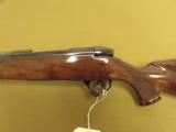 Weatherby, Mark V
Deluxe ", .378 Wby. Mag., 28" bbl w/ muzzle break ", 8 Lbs. 4 oz., 13 1/2" L/O.P. - 8 of 10