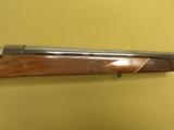 Weatherby, Mark V
Deluxe ", .378 Wby. Mag., 28" bbl w/ muzzle break ", 8 Lbs. 4 oz., 13 1/2" L/O.P. - 4 of 10