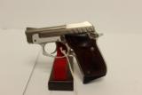 Taurus PT-22 Nickle and Rosewood .22LR - 1 of 2