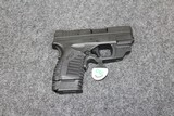 Springfield Model XDS in 45 ACP caliber with Crimson Trace laser - 1 of 2