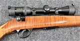 J.G. Anschutz Model 1710 in caliber 22 Long Rifle with a Tiger Stripe stock. - 1 of 8