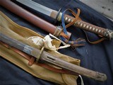 WW2 grouping Arasaka type 38 rifle w/capture papers Japanese swords 2
pictures-patches
and ship box 1943 - 10 of 15