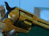 Pair of Colt 1st Gen. Single Actions Gold Finished Engraved Mother of Pearl Grips in 45 Cal. - 4 of 15