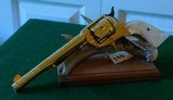 Pair of Colt 1st Gen. Single Actions Gold Finished Engraved Mother of Pearl Grips in 45 Cal. - 2 of 15