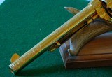 Pair of Colt 1st Gen. Single Actions Gold Finished Engraved Mother of Pearl Grips in 45 Cal. - 9 of 15