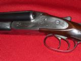 1103 LEFEVER 16 GHE REDONE BY KEITH KEARCHER, SMALL FRAME &
EJECTOR
Really nicely engraved Uncle Dan Lefever with small frame and straight grip, th - 1 of 8