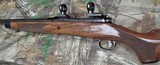 Engraved Savage 110 125th Anniversary Commemorative bolt action rifle in the 250 Savage - 2 of 11