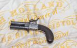 An Engraved H. Holland Rotating Double Barrel Percussion Pocket Pistol at our New York Showroom. Antique - circa 1850 - 1 of 5