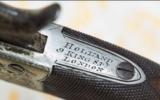 An Engraved H. Holland Rotating Double Barrel Percussion Pocket Pistol at our New York Showroom. Antique - circa 1850 - 3 of 5