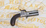 An Engraved H. Holland Rotating Double Barrel Percussion Pocket Pistol at our New York Showroom. Antique - circa 1850 - 2 of 5