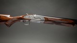 Holland & Holland 'Sporting ' Over and Under shotgun with 30 inch barrels and deluxe grade walnut