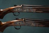 Holland & Holland 12 Gauge Matched Pair of 'Sporting Model Over and Under shotguns with 32 inch barrels.