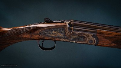 Holland & Holland 'Sporting' Deluxe 20 gauge Over and Under shotguns with 28 inch barrels.