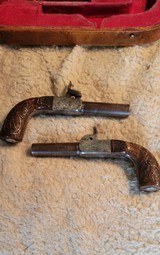 Matching pair of muff pistols - 1 of 5