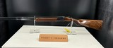 RIZZINI A 28-BORE INVERNESS SINGLE-TRIGGER ROUND-BODY OVER AND UNDER EJECTOR, serial no. 75596,