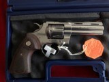 Colt Python 357 Magnum**New Production with 4.25 inch barrel**Stainless Steel**Wood Grips