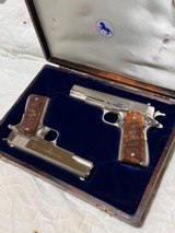 Cased pair of Colt 1911 Nickel pistols with presentation case.
.45 acp - 4 of 15