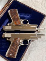 Cased pair of Colt 1911 Nickel pistols with presentation case.
.45 acp - 8 of 15