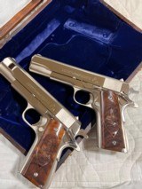 Cased pair of Colt 1911 Nickel pistols with presentation case.
.45 acp - 3 of 15