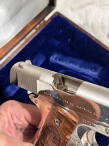 Cased pair of Colt 1911 Nickel pistols with presentation case.
.45 acp - 13 of 15